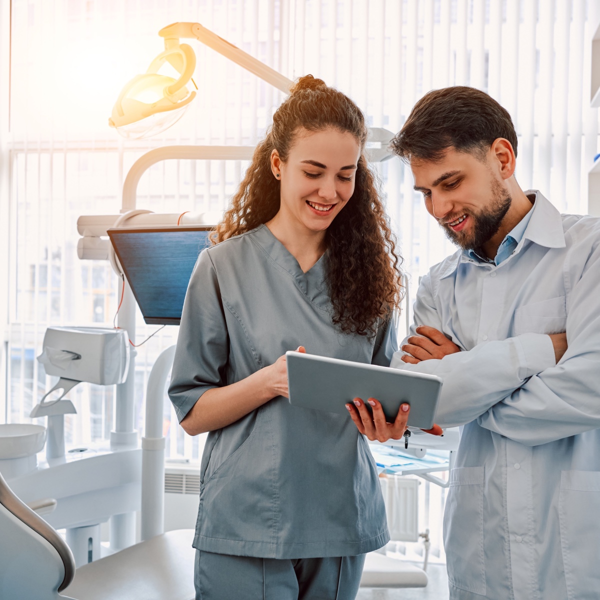 Two dentists using the OrthoPhoto app